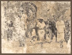 President William V. S. Tubman and Mrs. Tubman walk with dignitaries
