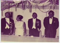 President Tubman and guests standing at reception table