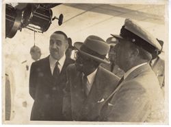 President William V. S. Tubman and others inspect object