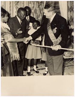 Dignitary shakes Mrs. Tubman's hand