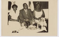 Vice President William  R. Tolbert, Jr. seated with women