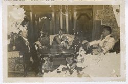 President William V. S. Tubman sits with fellow dignitaries in formal sitting room