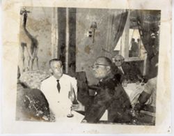 Vice President Tolbert sits and chats with guests