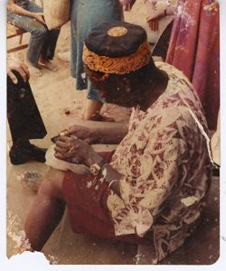 Man in traditional garb working with his hands