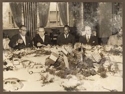 Guests seated at table for luncheon hosted by Fiat Company