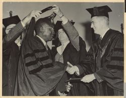 President William V. S. Tubman receives hood during special convocation
