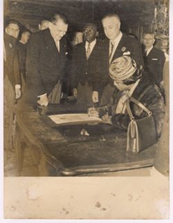 Mrs. Antionette Tubman signs a document