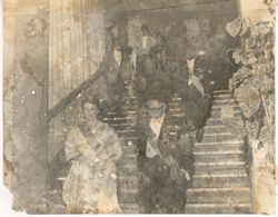 President Tubman and unidentified woman lead procession down stairs