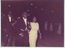 President Tubman escorting companion on to dance floor