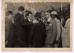 Dignitaries greet one another at the airport