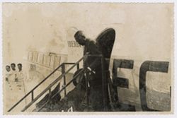 President Tubman decends stairs from an airplane