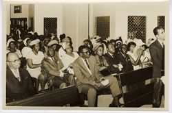 Guests sit during religious service