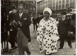 President William V. S. Tubman and Mrs. Tubman walk in procession in formal dress