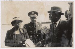 President and Mrs. Tuman stand with a military official in Spain