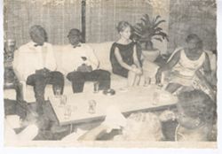 President William V. S. Tubman and Mrs. Tubman sit with guests and socialize