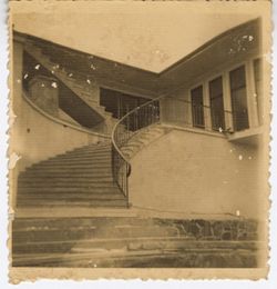 Curved staircase to entrance of building