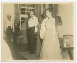 President William V.S. Tubman and Mrs. Tubman in formal attire standing together at reception