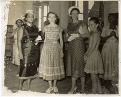 Mrs. Tubman stands with women and young girl during a school visit