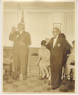Secretary of State J. Rudolph Grimes, Mrs. Thomas, Consul General David M. Thomas and Mrs. Isabelle Edwin toast drinks