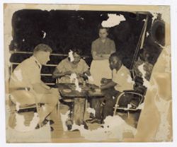 Guests play checkers on deck of ship