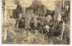 President William V. S. Tubman with officials in a formal hall