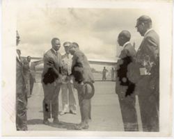 Officials greet guests on runway