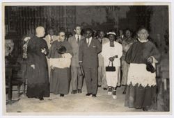 President and Mrs. Tubman tour a church in or near Seville, Spain with Catholic officials and other dignitaries