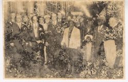 President William V. S. Tubman and Mrs. Tubman hold hands with Coocoo and walk with large crowd