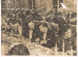 Dignitaries sit at a formal dinner