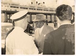 President Tubman shakes hands with a dignitary
