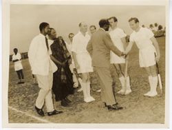 Ambassador C. T. O. King and other dignitaries meeting field hockey team