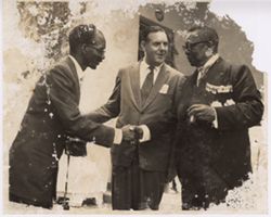 President Tubman shaking hands with unidentified photographer