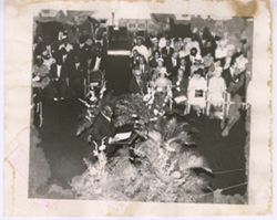 Man at podium in front of audience