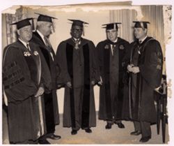 President William V. S. Tubman poses with scholars