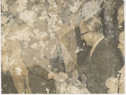 Officials shake hands with each other during event