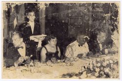 Guests seated at table for formal dinner