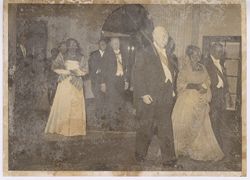 President and Mrs. Tubman walking along dignitaries