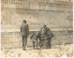 President Tubman and others attend to memorial wreath