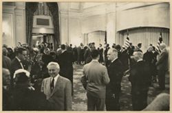 Guests mingle in a large reception room