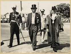 President William V. S. Tubman, Governor Sir Hugh Foot and officials walk in ceremonial