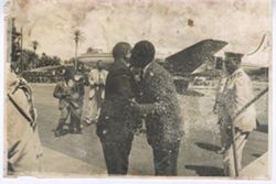 Two men hug while at airport