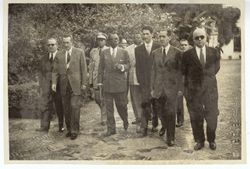 President Tubman walks with dignitaries in or near Seville, Spain