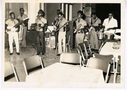 Group of men playing music and singing