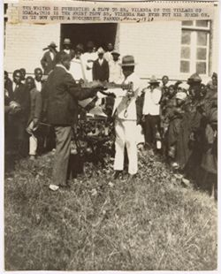 Writer is presenting a plow to Sr. Vilenga at the village of Ndala. Is first plaw Sr. Vilenga has ever put his hands on. His is now quite a successful farmer May 1930