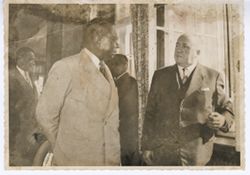 President William V. S. Tubman and man have conversation while walking