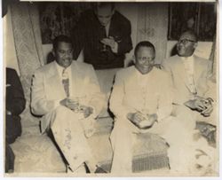 President William V. S. Tubman and officials sit on sofa at reception