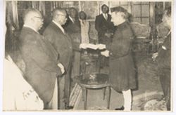 President William V. S. Tubman and man in traditional dress hold envelope