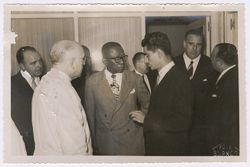 President Tubman stands with dignitaries