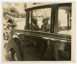 President William V. S. Tubman and Mrs. Tubman in the back of an automobile