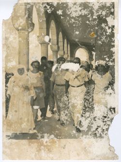 President William V. S. Tubman and Mrs. Tubman walk with hosts during tour